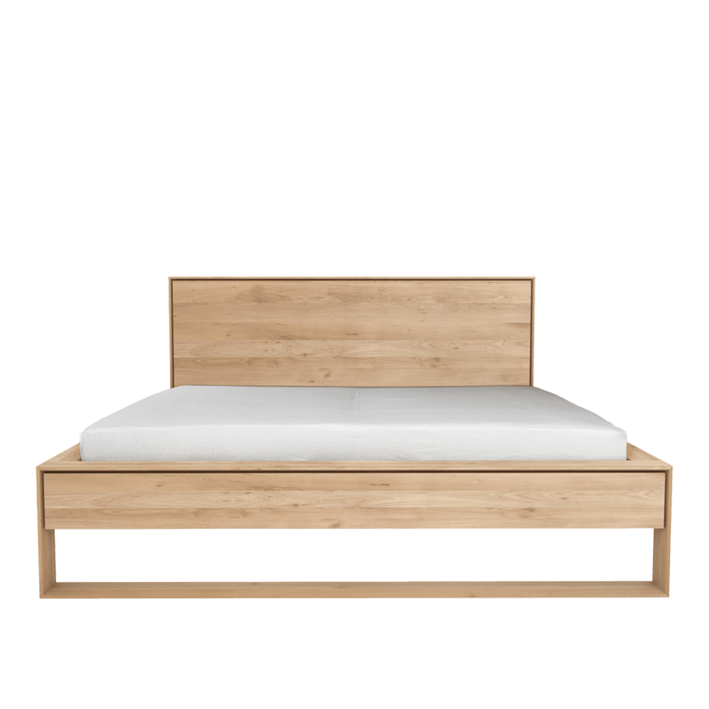 solid oak contemporary bed with panel headboard in a light oil finish